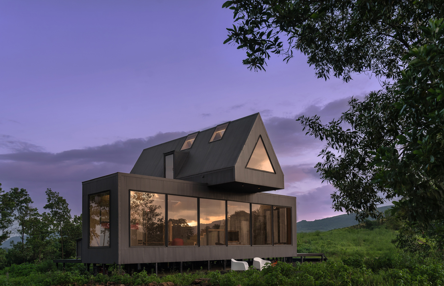 A small architect-designed cabin standing alone in northern woodland