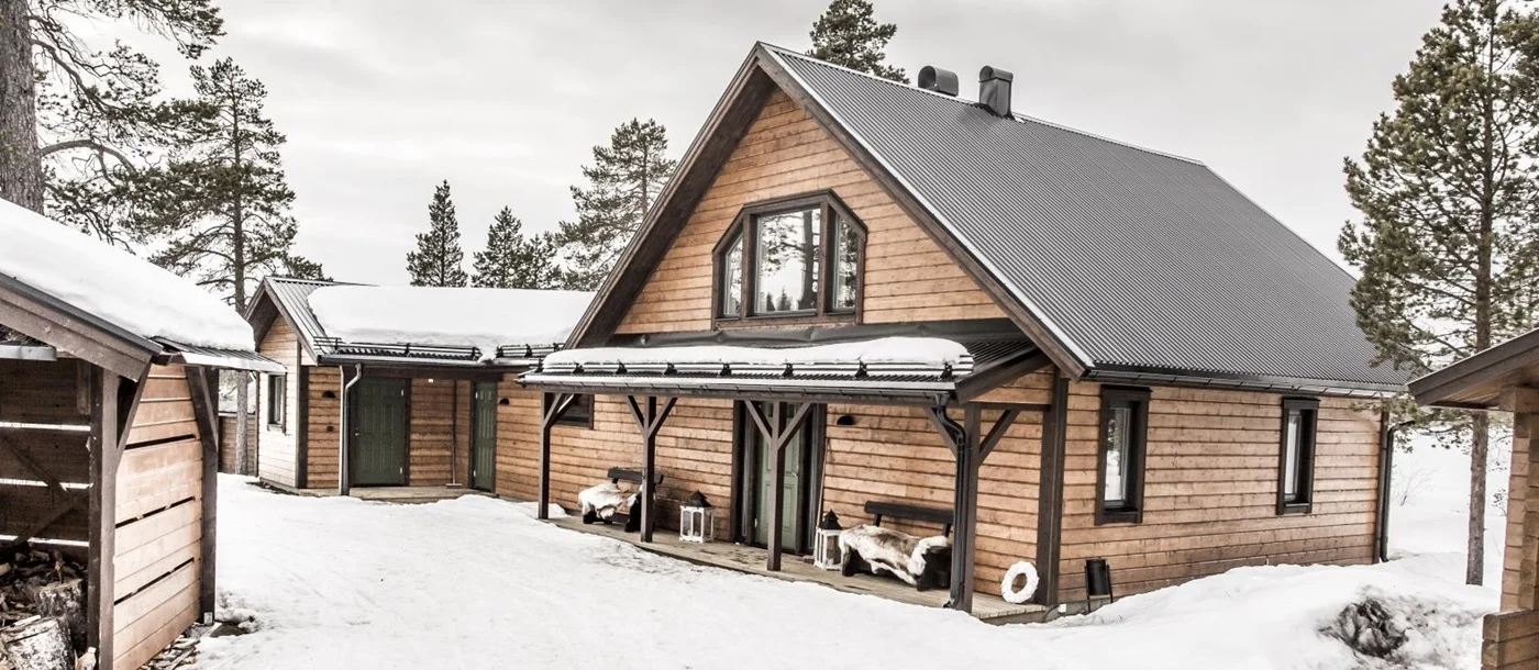 Sledges and harness lines outside Fjellborg Arctic Lodge in the Kiruna region